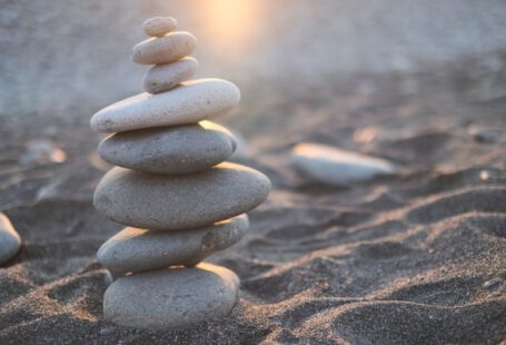Work Balance - stack of stones on brown sand