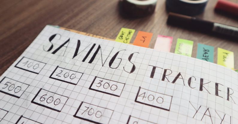 Financial Planning - Savings Tracker on Brown Wooden Surface
