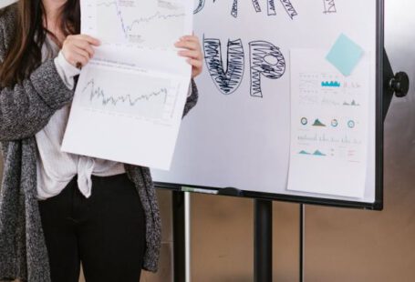 Entrepreneur Branding - Woman in Gray Coat Holding White Printer Paper