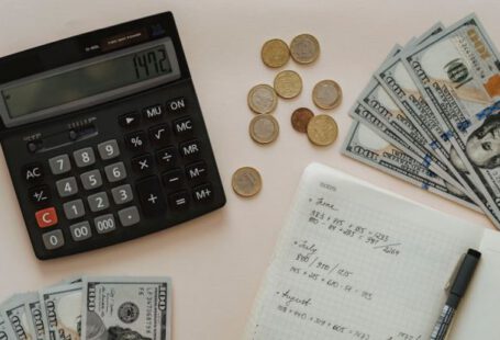 Budgeting Tips - Black Calculator beside Coins and Notebook