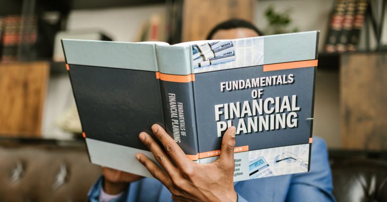 Financial Planning - Person Reading a Book About Fundamentals of Financial Planning