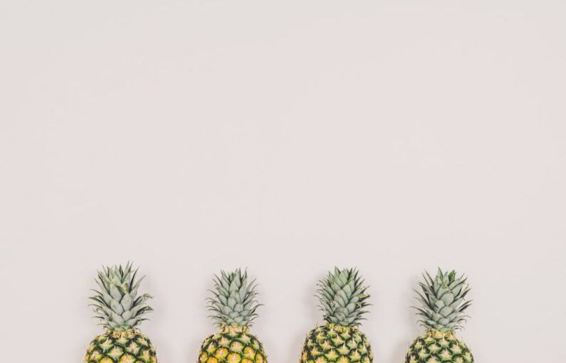 Hospitality Jobs - four pineapples on white background