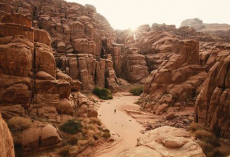 Internship Experience - a person walking through a canyon in the desert