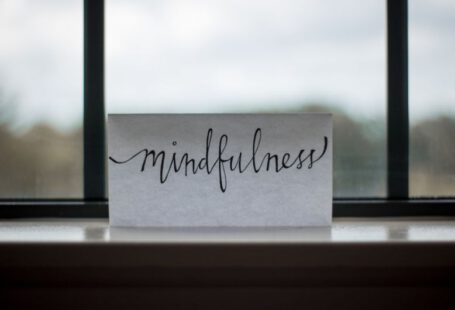 Motivation Tips - mindfulness printed paper near window